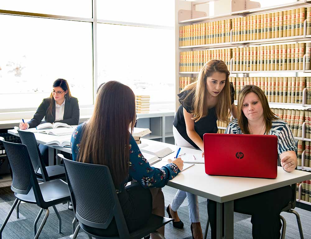 law and legal students working in a library