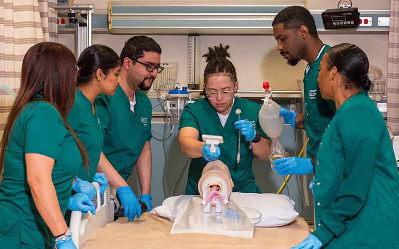 respiratory care students working on patient