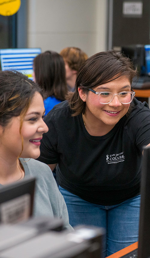 Student attending computer lab orientation